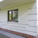 Naprawa popękanych murów w domu jednorodzinnym z zastosowaniem Brutt Technologies.