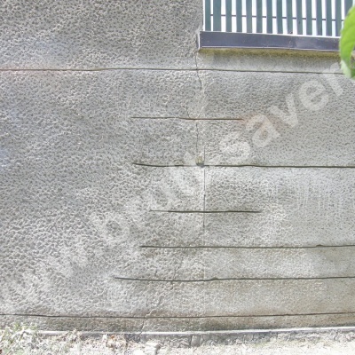 Naprawa murów - przykład wzmocnienia popękanych ścian z wykorzystaniem profili śrubowych Brutt'a o różnych długościach.